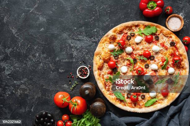 Italian Pizza On Black Concrete Background Stock Photo - Download Image Now - Pizza, Backgrounds, Gourmet