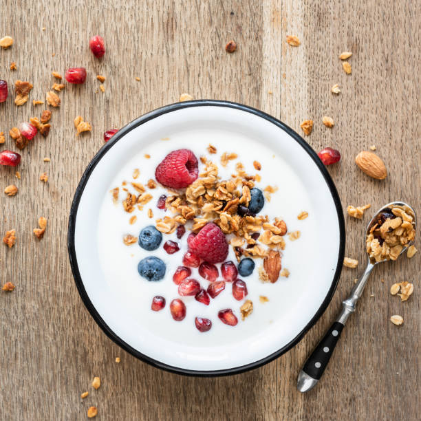 istock Yogurt with granola, pomegranate seed and berries 1042321812