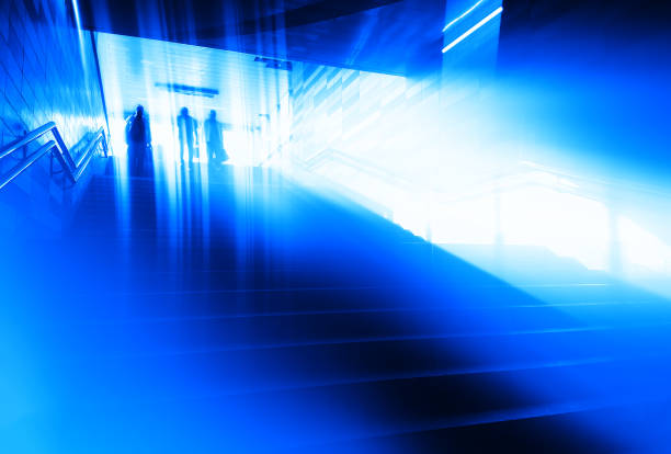 istock Group of people entering underground transportation background 1042323182
