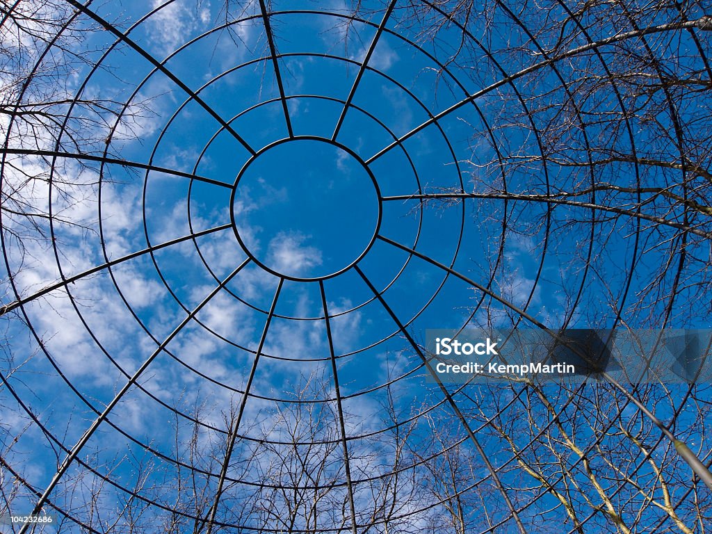 Concentric Circles A garden support structure for training plants and trees into a domed shelter. Made of steel it is a series of concrenric circles Arch - Architectural Feature Stock Photo