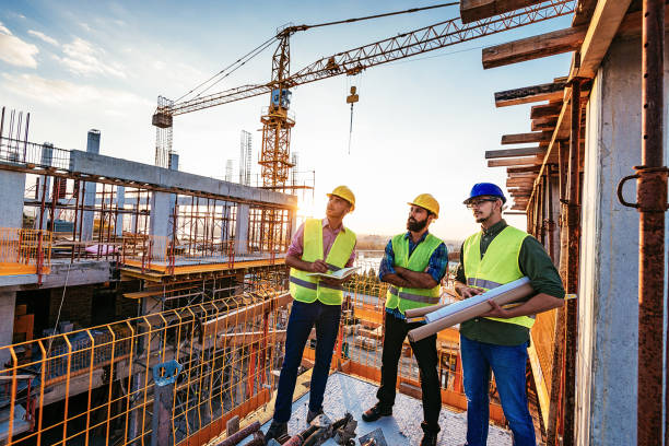 istock Experienced engineers standing on the top floor of skyscraper 1042329116