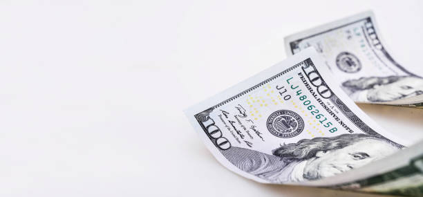 istock One hundred dollars banknotes on white background 1042331522