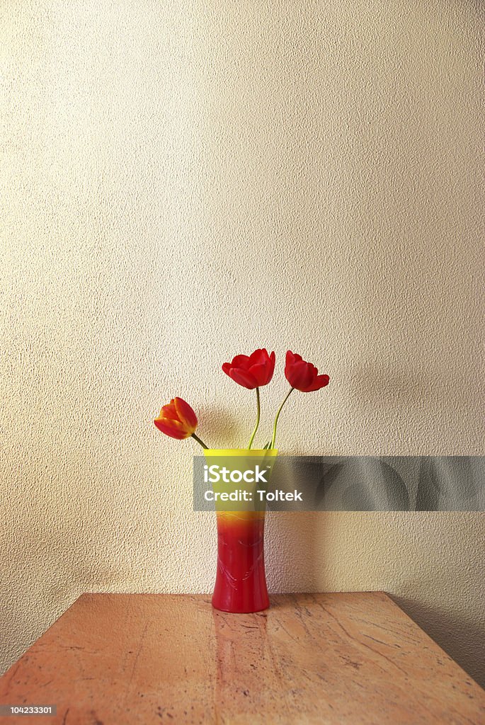 Three tulip Three tulip in vase. Decoration in room. Red Stock Photo