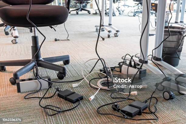 Concept Of Clutter In Office Unwound And Tangled Electrical Wires Under The Table 5s System Of Lean Manufacturing Stock Photo - Download Image Now