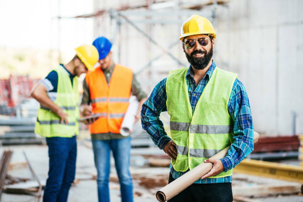 istock Masculine smiling engineer with beard and sunglasses 1042336632