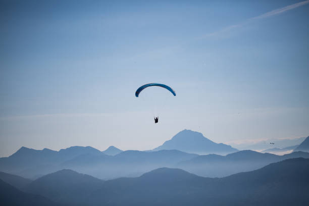 istock Paragliders at Brauneck, Lenggries, blue sky 1042340198