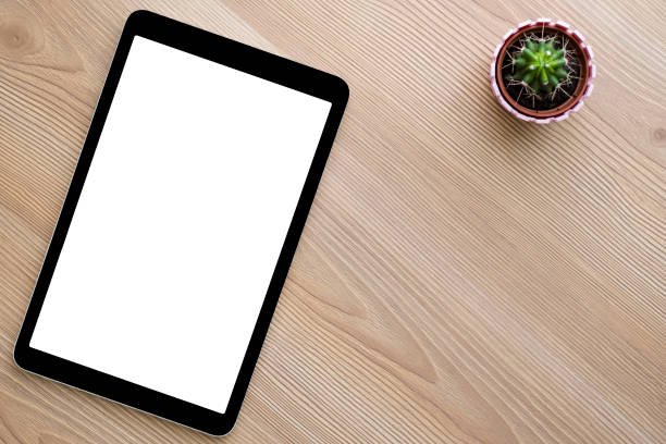 istock Tablet and smart phone on wooden table background 1042346978