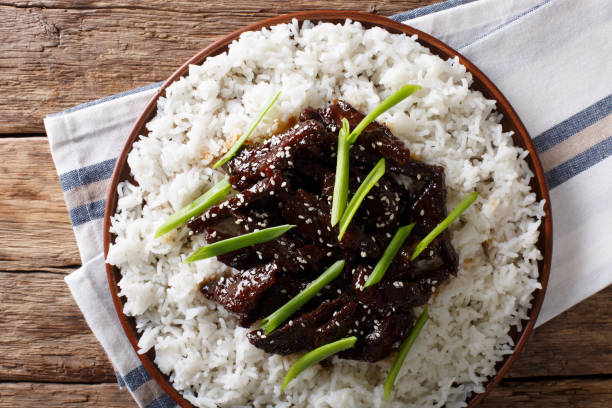 spicy Mongolian beef with rice close-up. horizontal top view