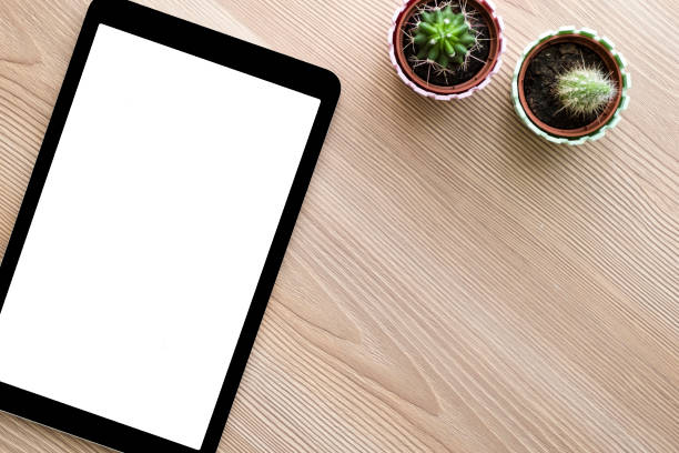 istock Tablet and smart phone on wooden table background 1042347366