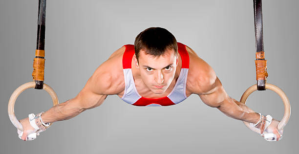 istock Male gymnasts working on the rings 104234827