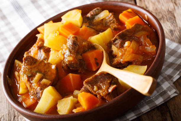istock Spanish stew estofado with beef and vegetables in a bowl close-up. horizontal 1042349940