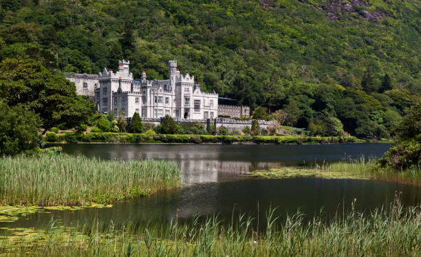 Kylemore Abbey in County Galway, Ireland. Kylemore Abbey, a Benedictine monastery founded on the grounds of Kylemore Castle, in Connemara. Famous tourist attraction in County Galway, Ireland. kylemore abbey stock pictures, royalty-free photos & images