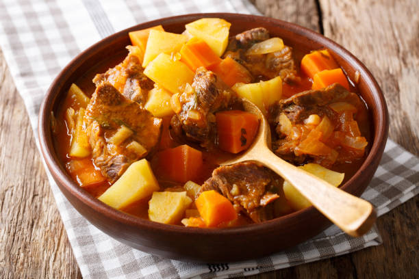 istock Braised beef Estofado with vegetables close-up on the table. horizontal, rustic 1042366058