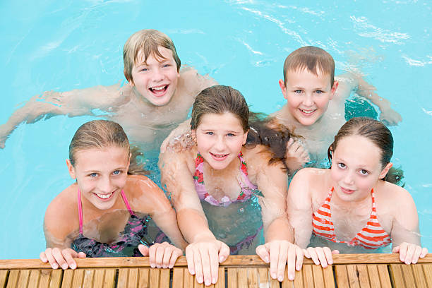 istock Young friends in swimming pool 104236903