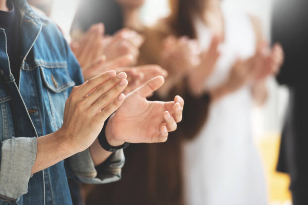 Cropped image of Creative designers audience applauding at a business seminar. Cropped image of Creative designers audience applauding at a business seminar.
Students standing and clapping in the classroom. audience photos stock pictures, royalty-free photos & images
