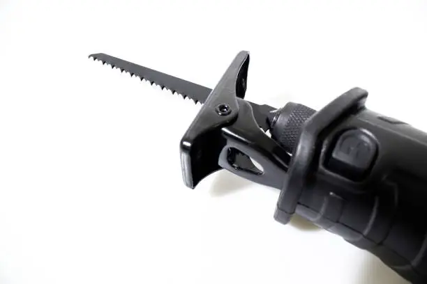 Photo of Reciprocating saw with a blade isolated in a white background composition