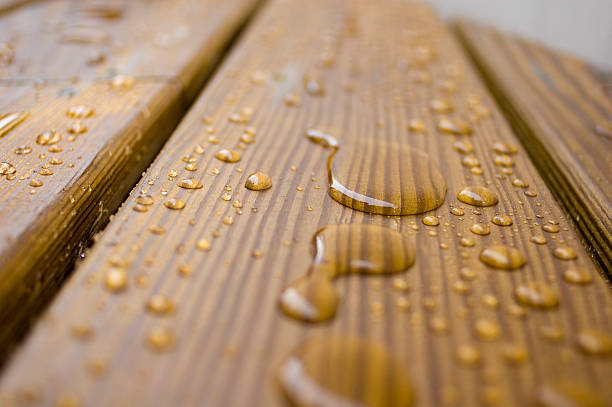 istock Beads of water on a wooden deck 104237703