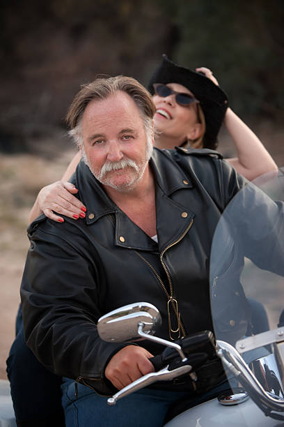 istock Fun couple riding a white motorcycle outside 104237783