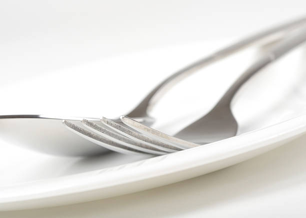 istock Photo of fork and spoon on plate 104238354