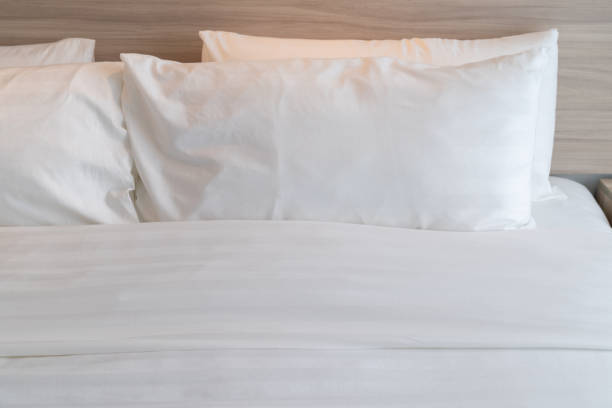istock modern bedroom with wooden bed 1042385880