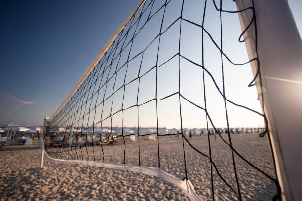 istock beach volleyball net on the seashore on the sunset 1042385968