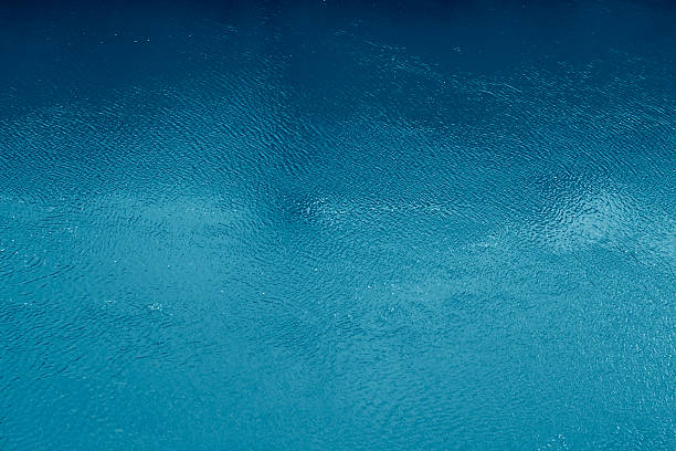 Superfície de água do oceano azul - fotografia de stock