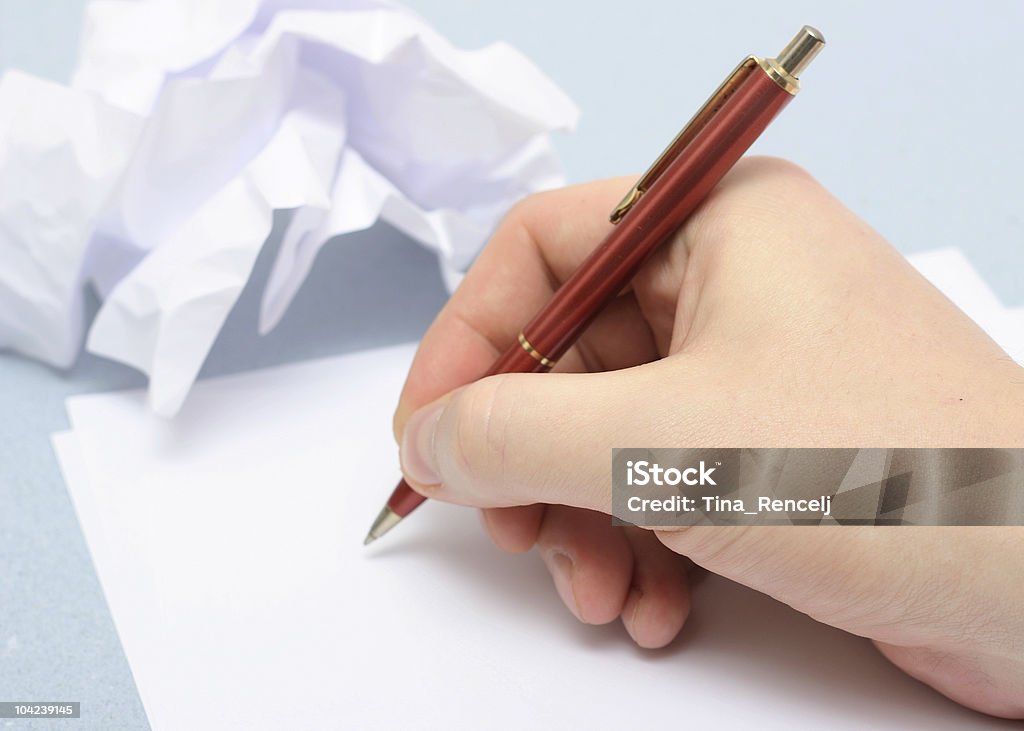 Writing in pen on blank white paper Writing on empty sheet of paper Adult Stock Photo