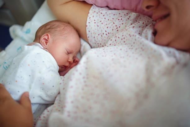 istock Baby sleeps near mother 1042395932