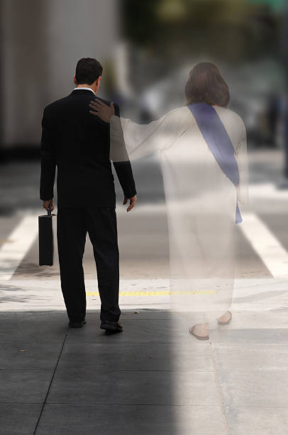 Photo of businessman walking with ghost of Jesus Double Exposure of a businessman walking down the street with Jesus at his side walking with god stock pictures, royalty-free photos & images