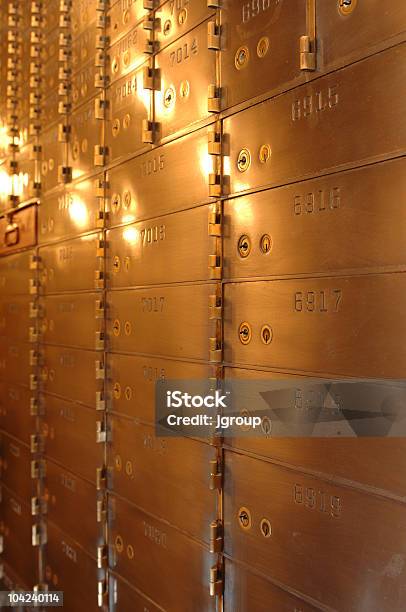Vertical Photo Of Safety Deposit Boxes In Yellow Light Stock Photo - Download Image Now
