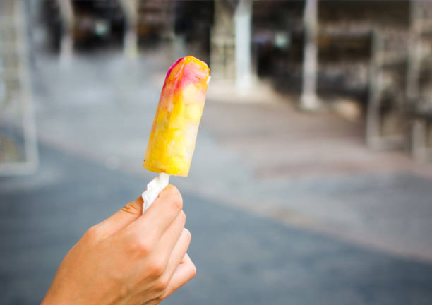 istock Girl holding fruit ice cream 1042403538