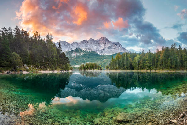 Mountain peak Zugspitze Summer day at lake Eibsee near Garmisch Partenkirchen. Bavaria, Germany Garmisch-Partenkirchen, Bavaria, Europe, Germany, Relief Map mountain sunrise stock pictures, royalty-free photos & images