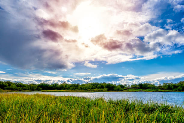 istock Evening sun behind clouds above the lake 1042407656