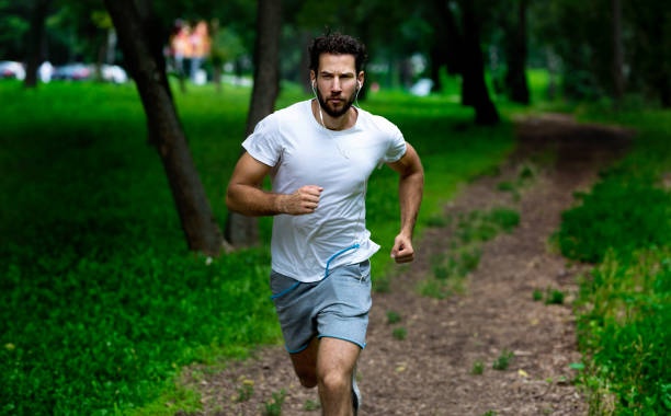 istock Athlete running in the forest 1042407752