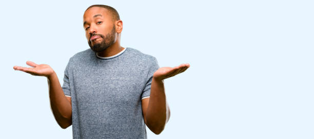 istock African american man with beard doubt expression, confuse and wonder concept, uncertain future 1042411472