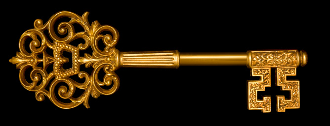 Gold master key on black with clipping path