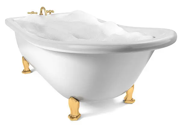 A Cast-Iron standing bathtub on white filed with soap suds with clipping path included