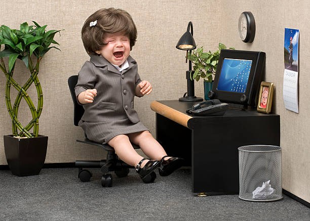 Office Babe Baby dressed in professional office attire crying at her desk child labor stock pictures, royalty-free photos & images