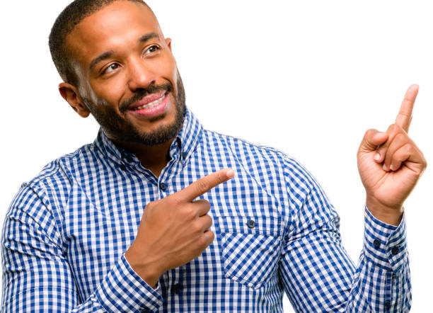 istock African american man with beard pointing away side with finger 1042414528