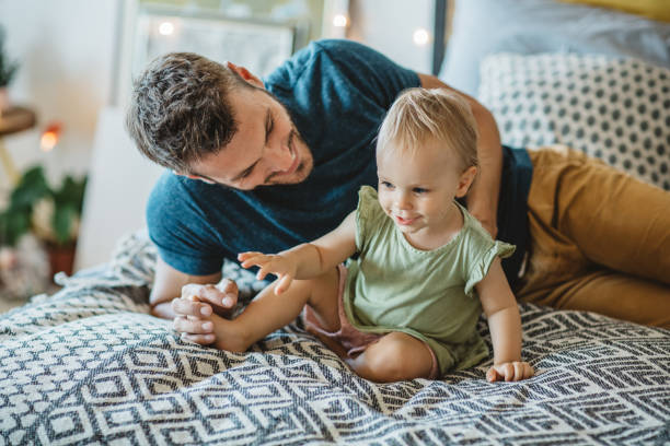 istock Father and daughter spend weekend at home 1042414578