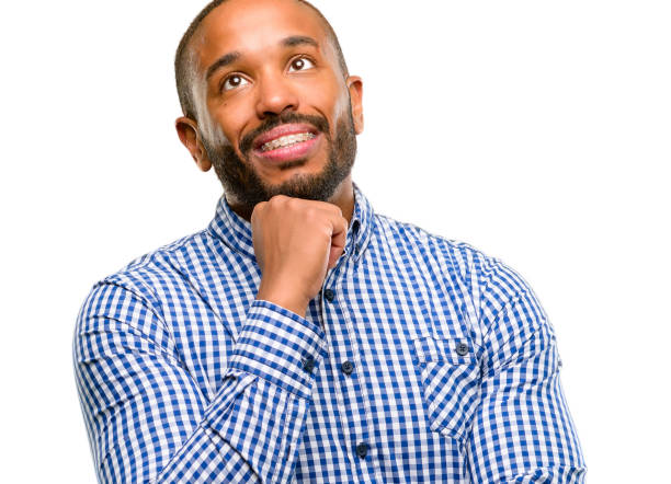 istock African american man with beard thinking and looking up expressing doubt and wonder 1042415296