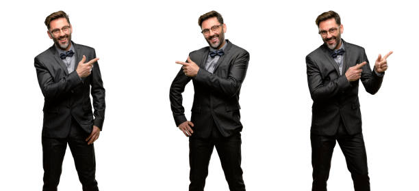 istock Middle age man, with beard and bow tie pointing away side with finger 1042416332
