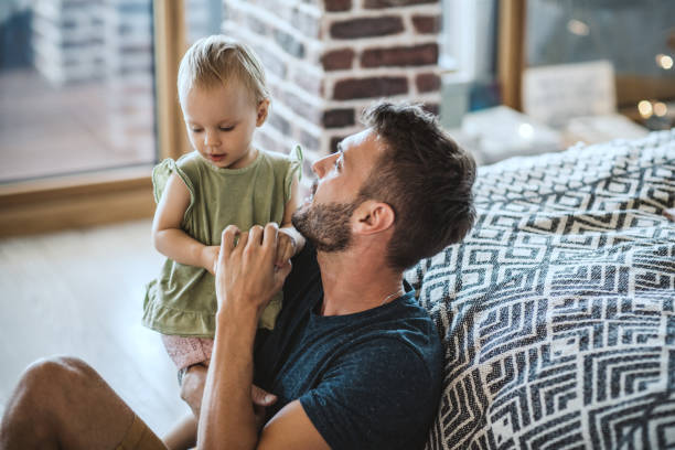 istock Father and daughter spend time together at home 1042418762