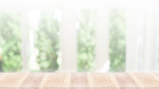 istock Wooden table top on green nature background 1042419376
