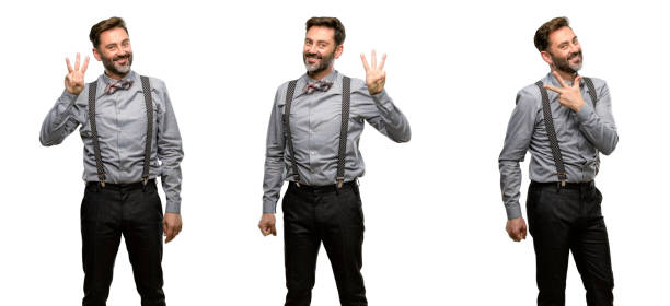 istock Middle age man, with beard and bow tie raising his finger, is the number three 1042419470