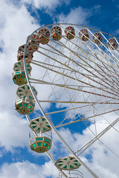 istock Ferris wheel in cloudy sky 104242367