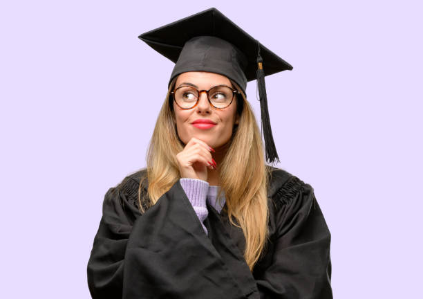 istock Young woman university graduate student thinking and looking up expressing doubt and wonder 1042425250