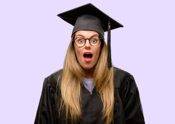 istock Young woman university graduate student scared in shock, expressing panic and fear 1042425272