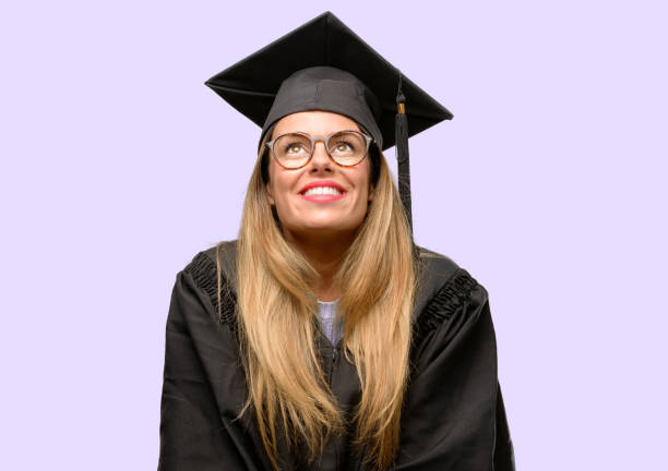 istock Young woman university graduate student thinking and looking up expressing doubt and wonder 1042425294