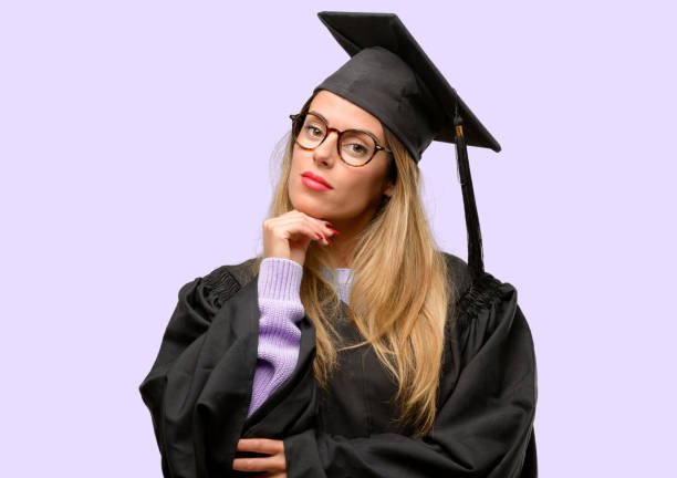 istock Young woman university graduate student thinking and looking up expressing doubt and wonder 1042425366